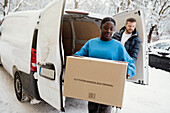 Couple unloading van