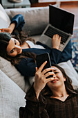 Female coworkers on sofa