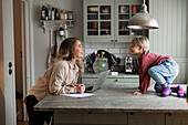 Mother and son in kitchen