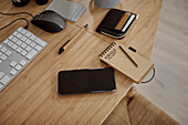 Notepad and cell phone on desk