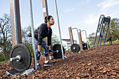 Woman exercising in outdoor gym