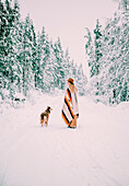 Woman with dog at winter