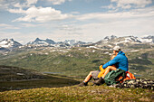 Hikers looking at mountains