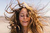 Portrait of teenage girl with messy hair