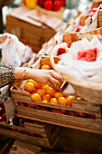 Woman doing shopping in shop with organic food
