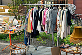 Clothes in rack at yard sale