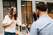 Coworkers talking at corridor