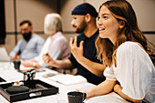 Smiling woman at business meeting