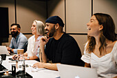 Coworkers having meeting in office