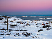 Houses in snowy landscape in archipelago