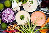 Various vegetable salads and dips in bowls