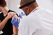 Young man getting vaccinated against Covid-19