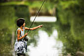 View of boy fishing