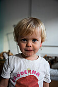 Portrait of blonde boy in dirty t-shirt