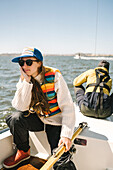 Young woman sitting on boat