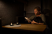 Woman with dog reading book