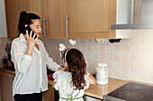 Mother and daughter in kitchen