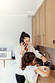 Mother and daughter in kitchen