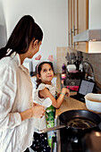 Mother and daughter in kitchen