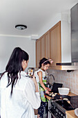 Mother and daughter in kitchen