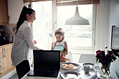 Mother and daughter in kitchen