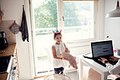 Smiling girl in kitchen