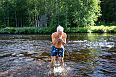 Man standing in river