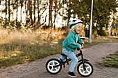 Happy child cycling