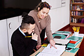 Teachers talking in classroom