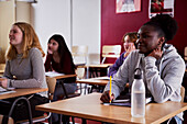 Teenagers sitting in classroom