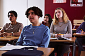 Teenage boy sitting in classroom