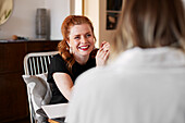 Smiling woman talking to friend