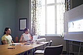 People in boardroom during business meeting