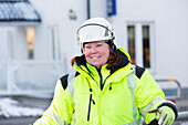 Portrait of worker wearing reflective clothing