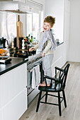 Boy preparing food in kitchen