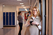 Woman standing at corridor