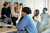 Group of students talking in class