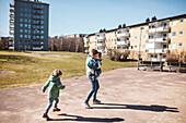 Mother walking with children