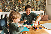 Mother and son doing craft together
