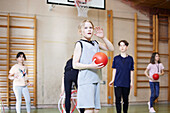 Children having PE class in school gym