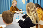 Children having lunch in cafeteria