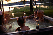 Female friends relaxing in hot tub