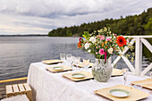 Set dinner table by lake