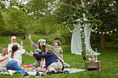 Family having picnic during midsummer