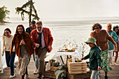 Family having lunch on pier