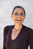 Portrait of smiling mature woman in glasses