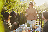 Friends having meal in garden