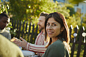 Smiling woman at table in garden