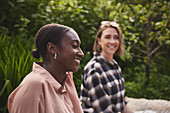 Smiling woman sitting in garden