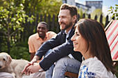 Friends sitting together in garden